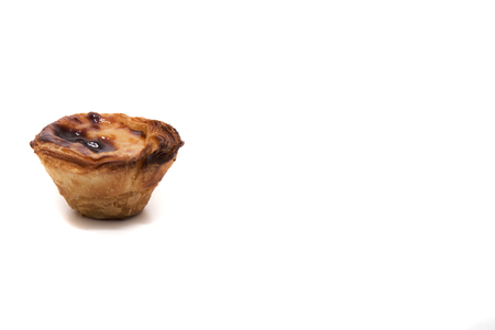 Famous Portuguese egg pastry tart called 'Pastel de Belem' isolated on white background.