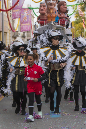 LOULE, PORTUGAL - FEB 2018: Colorful Carnival (Carnaval) Parade festival participants on Loule city, Portugal.のeditorial素材