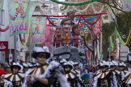 LOULE, PORTUGAL - FEB 2018: Colorful Carnival (Carnaval) Parade festival participants on Loule city, Portugal.のeditorial素材