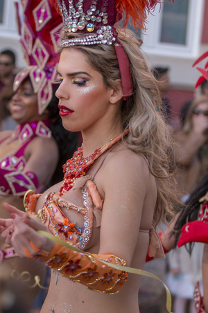 LOULE, PORTUGAL - FEB 2018: Colorful Carnival (Carnaval) Parade festival participants on Loule city,...