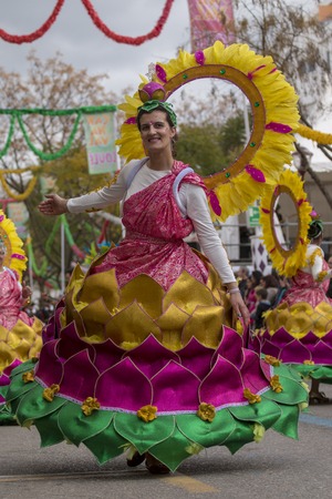 LOULE, PORTUGAL - FEB 2018: Colorful Carnival (Carnaval) Parade festival participants on Loule city,...