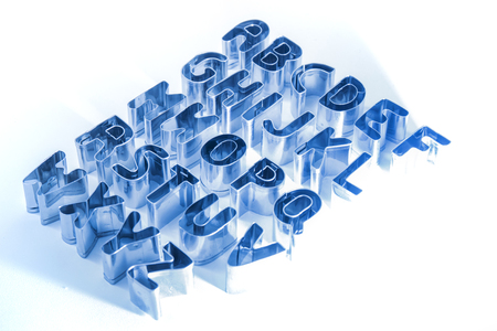cookie cutter letters isolated on a white background.の写真素材