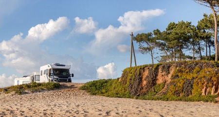 Beautiful sandy beaches and pine trees in Quarteira, Algarve, Portugalの写真素材