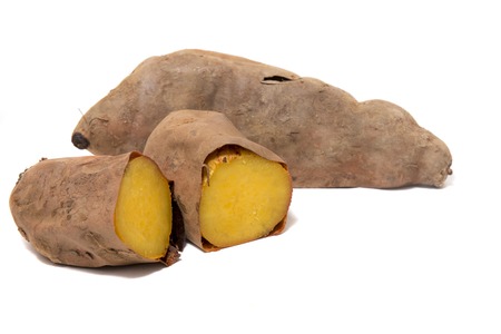 Cooked oven sweet potatoes isolated on a white background.の写真素材