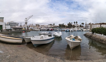 Wide view of Faro city docks with fishing and recreational boats.のeditorial素材