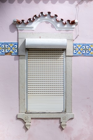 Typical windows of Portuguese architecture in buildings.