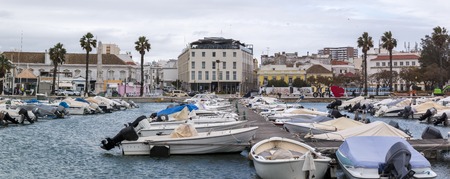 Wide view of Faro city docks with fishing and recreational boats.のeditorial素材