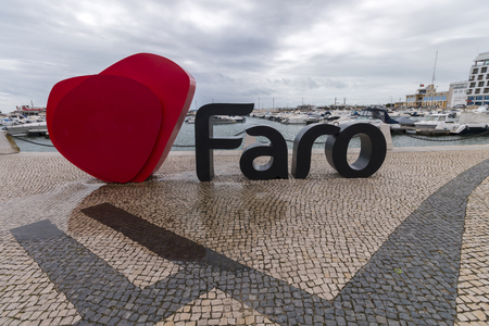 FARO, PORTUGAL: 4th of March, 2018 - Faro city logo name with big letters near the marina.のeditorial素材