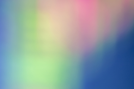 Abstract color blur background comprised of several colors like pink and green.
