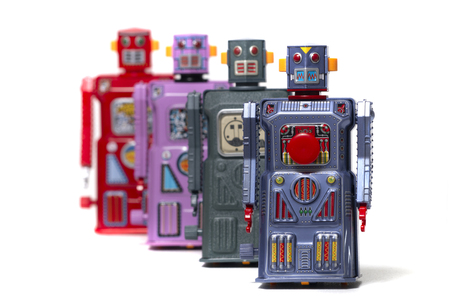 Vintage tin robot toys isolated on a white background.
