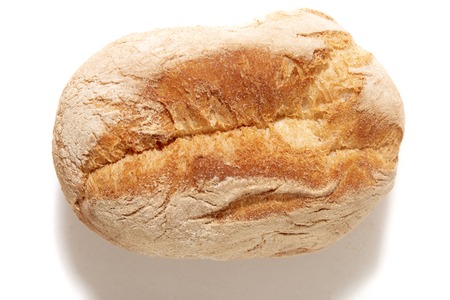 Brown simple bun isolated on a white background.