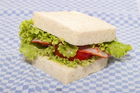 sandwich with paio sausage over a blue cloth.の写真素材
