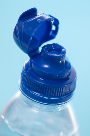 plastic water bottle over a blue background.