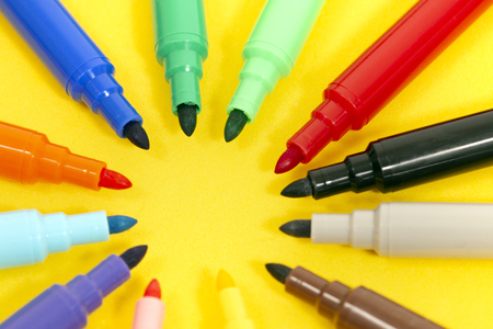 set of felt pens isolated on a yellow background.の写真素材