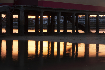 Sunset view of the life saver house located in the village of Fuseta, Portugal.の写真素材