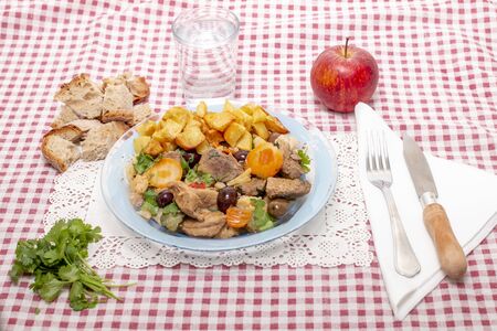 Close up view of a Portuguese meal of cooked meat with potatoes.の写真素材