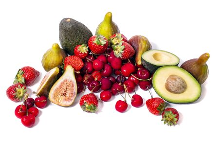 View of tasty fresh mix of exotic fruit, including avocado, cherry, figs and strawberries.の写真素材