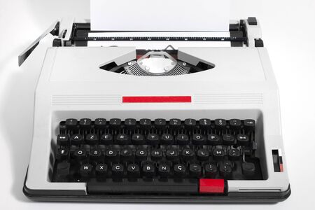 Vintage portable typewriter isolated on a white background.の写真素材