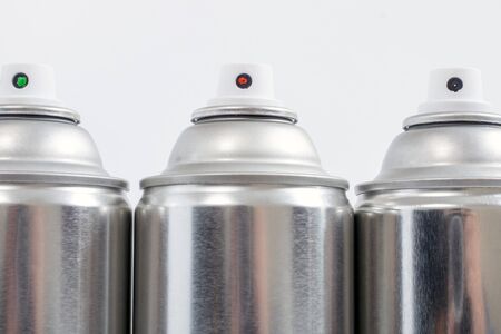 Close up view of silver spray cans on a white background.の写真素材