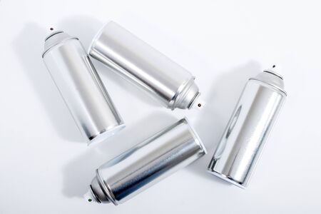 Close up view of silver spray cans on a white background.の写真素材