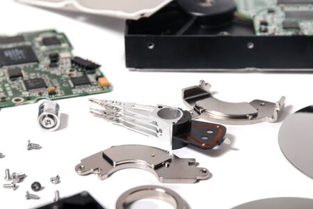 Disassembled hdd drive parts isolated on a white background.の写真素材