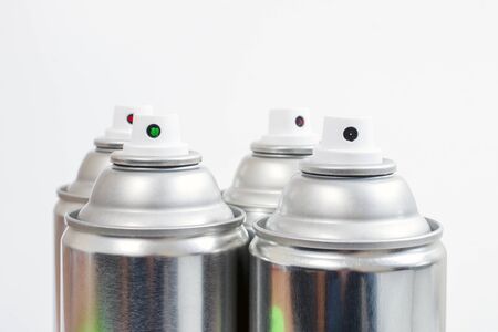 Close up view of silver spray cans on a white background.の写真素材