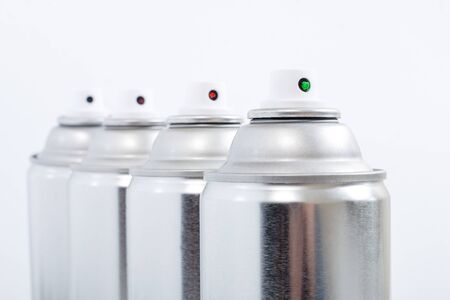 Close up view of silver spray cans on a white background.の写真素材