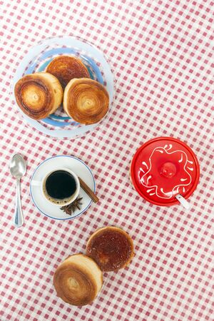 Rolled honey pastries with coffee, typical of Olhao city, Portugal.の写真素材