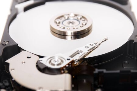 Close up view of a computer hard drive isolated on a white background.