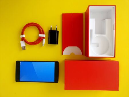 cellphone and case isolated on a yellow background.の写真素材