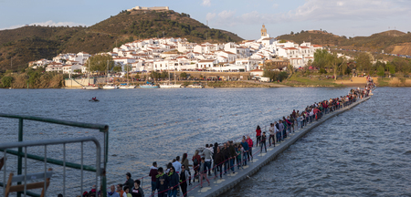 ALCOUTIM, PORTUGAL: MARCH 30, 2019: Festival of smuggling (contrabando), where many people cross the river to the other side, to Sanlucar de Guadiana, Huelva, Andalusia, Spain.のeditorial素材