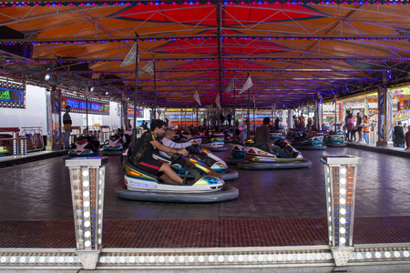 FARO, PORTUGAL - OCTOBER  2018: Fun fair event Santa Iria with games, street food, ferry wheels, bumper cars and many diverse activities.のeditorial素材