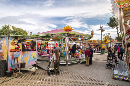 FARO, PORTUGAL - OCTOBER  2018: Fun fair event Santa Iria with games, street food, ferry wheels, bumper cars and many diverse activities.のeditorial素材