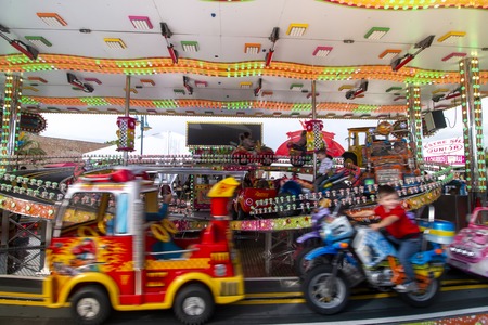 FARO, PORTUGAL - OCTOBER  2018: Fun fair event Santa Iria with games, street food, ferry wheels, bumper cars and many diverse activities.のeditorial素材