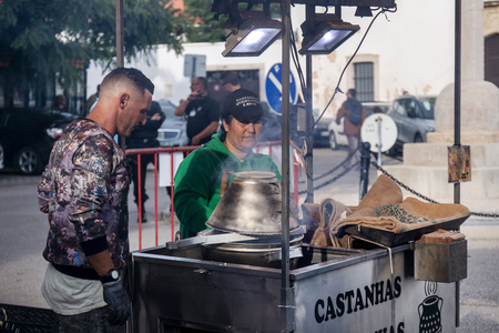 FARO, PORTUGAL - OCTOBER  2018: Fun fair event Santa Iria with games, street food, ferry wheels, bumper cars and many diverse activities.のeditorial素材