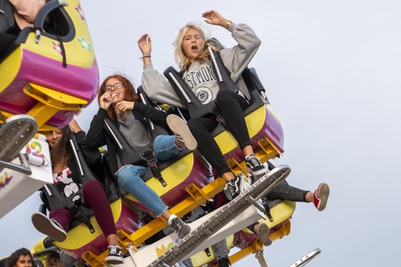 FARO, PORTUGAL - OCTOBER  2018: Fun fair event Santa Iria with games, street food, ferry wheels, bumper cars and many diverse activities.のeditorial素材