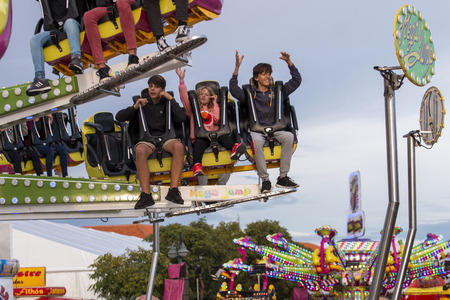 FARO, PORTUGAL - OCTOBER  2018: Fun fair event Santa Iria with games, street food, ferry wheels, bumper cars and many diverse activities.のeditorial素材