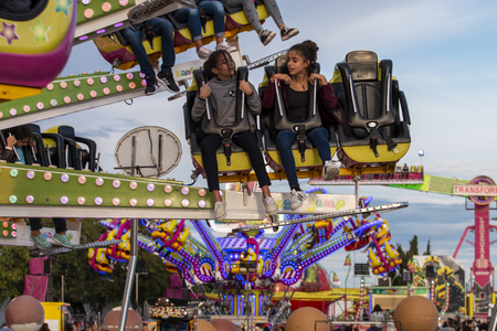 FARO, PORTUGAL - OCTOBER  2018: Fun fair event Santa Iria with games, street food, ferry wheels, bumper cars and many diverse activities.のeditorial素材