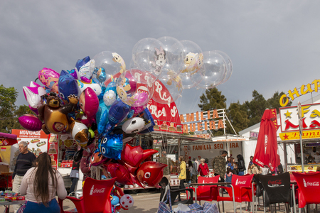 FARO, PORTUGAL - OCTOBER  2018: Fun fair event Santa Iria with games, street food, ferry wheels, bumper cars and many diverse activities.のeditorial素材