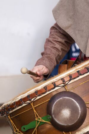 Close up of large medieval drummer musician detail.