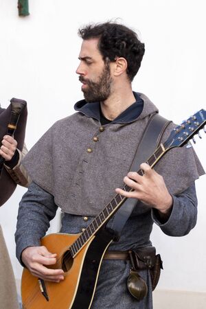 PADERNE, PORTUGAL - January 1st, 2020: Close up view of musician playing classic guitar.