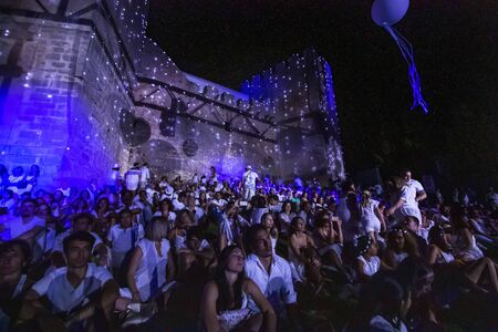 LOULE, PORTUGAL: 31st AUGUST 2019 - An event called White Night, where everybody dresses white clothing and watches shows, concerts and performances.のeditorial素材