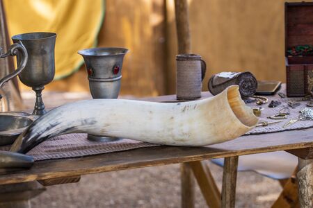Close up view of an animal drinking horn at a medieval fair.のeditorial素材