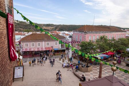 SILVES, PORTUGAL - August 11th, 2019 : People walk and shop in a Medieval fair event.のeditorial素材