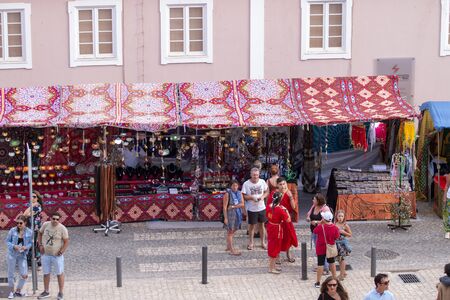 SILVES, PORTUGAL - August 11th, 2019 : People walk and shop in a Medieval fair event.のeditorial素材