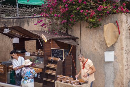 SILVES, PORTUGAL - August 11th, 2019 : People walk and shop in a Medieval fair event.のeditorial素材
