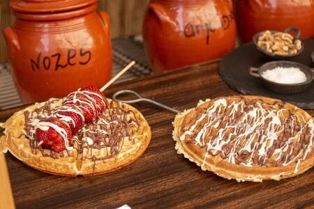 Tasty waffle with fruit covered with chocolated and goodness.のeditorial素材