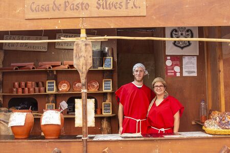 SILVES, PORTUGAL - August 11th, 2019 : Food court area of  Medieval festival where people eat...