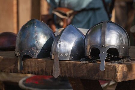 Close up view of Medieval battle helmets.