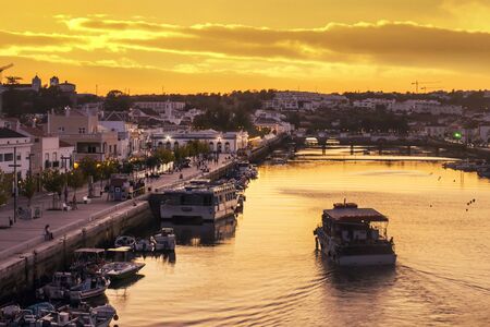 Sunset landscape of Tavira city river located in the Algarve, Portugal.の写真素材